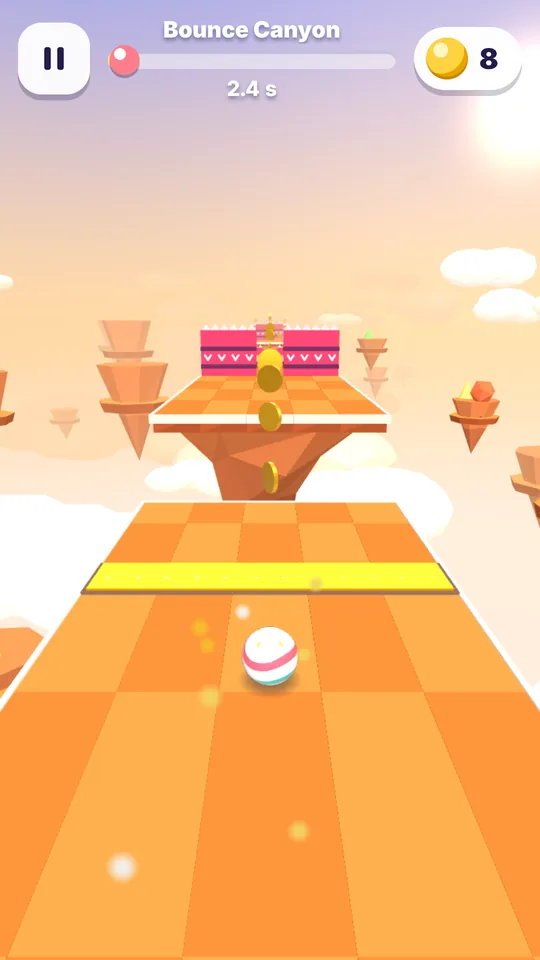 Bounce Canyon: an orange track leads to a yellow jump pad and a raised mesa with coins above it.